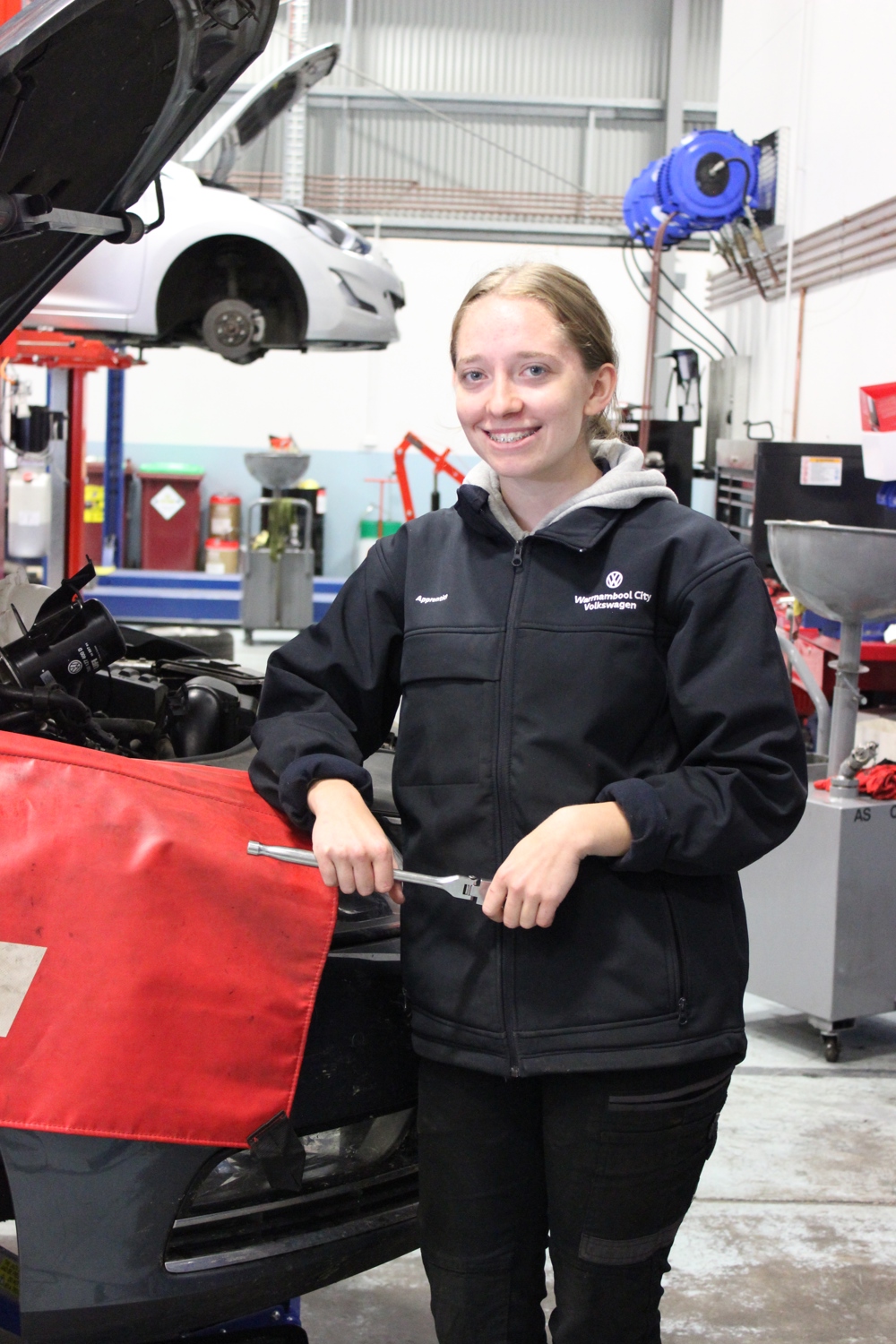 Cayla working in automotive maintenance